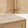 Close-up view of a wooden cabinet with rattan detailing. Anteprima dell’immagine prodotto
