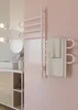 A modern bathroom with a white towel rack mounted on a pink tiled wall. Náhľad obrázku produktu