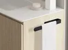 A close-up view of a bathroom vanity with a towel rack and a white towel. Náhled obrázku produktu