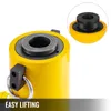 Close-up of the top of a yellow hydraulic cylinder with a metal fitting and a ring for lifting. A smaller inset image shows a black rubber adapter on a yellow base. Podgląd zdjęcia produktu