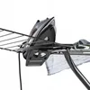 A close-up view of an iron resting on an ironing board. Produktbild-Vorschau