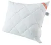 A white quilted pillow on a white background. Voir les images du produit