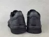 The back view of a pair of black Puma sneakers. Voir les images du produit