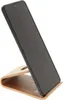 A black smartphone is placed on a wooden stand against a white background. Náhľad obrázku produktu