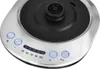 A close-up view of the control panel and top of a stainless steel electric kettle. Voir les images du produit