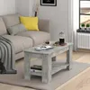 A living room scene with a couch and a coffee table. Voir les images du produit