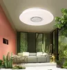 A modern living room with a couch, plants, and a ceiling light. Produktbild-Vorschau