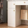 A close-up view of a white vanity table with drawers and a shelf. Podgląd zdjęcia produktu