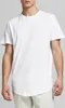 A man wearing a white t-shirt and light-colored pants against a light gray background. Produktbild-Vorschau