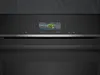 Close-up of a modern oven's digital display showing cooking options. Produktbild-Vorschau