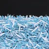 A pile of shredded blue and white paper. Produktbild-Vorschau