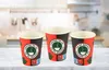 Three disposable coffee cups are arranged on a marble countertop in front of a blurred kitchen background. Produktbild-Vorschau