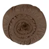 A rolled-up brown fitted sheet on a white background. Produktbild-Vorschau