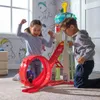Two children are playing with a toy tower and race track in a room with Paw Patrol themed wallpaper. Náhľad obrázku produktu