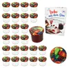 A set of glass jars with fruit-themed lids, a cookbook, and a decorative plate, all arranged on a white background. Produktbild-Vorschau