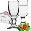 Two elegant wine glasses are shown next to a box of Krosno Balance glasses, with a strawberry and mint leaves in the foreground. Podgląd zdjęcia produktu