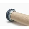 Close-up of the end of a wooden rolling pin with measurement markings and adjustable thickness rings. Produktbild-Vorschau
