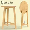A wooden folding table shown in two configurations: set up and folded. Produktbild-Vorschau
