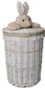 A white wicker laundry basket with a lid and a plush bunny toy on top. Produktbild-Vorschau