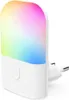 A white LED night light with a multicolored light display, plugged into a wall socket. Produktbild-Vorschau