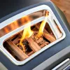 Close-up of wood logs burning inside a grill. Produktbild-Vorschau