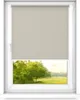 A window with a roller blind partially covering the view of a green landscape. Anteprima dell’immagine prodotto