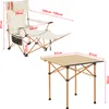 A diagram showing a camping chair and table with dimensions indicated by red lines and text. Produktbild-Vorschau