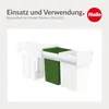 A marketing image showing a white pull-out trash bin system with a green bin and a white bin, installed in a cabinet. Podgląd zdjęcia produktu