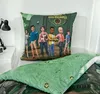 A bed with a pillow and duvet featuring characters from Jurassic World Camp Cretaceous. Produktbild-Vorschau