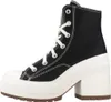 A side view of a black Converse Chuck 70 De Luxe Heel shoe with a white platform and heel. Produktbild-Vorschau
