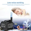 A child sleeping peacefully next to a water pump in an aquarium. Produktbild-Vorschau