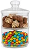 A two-tiered glass candy jar filled with chocolates and colorful candies. Produktbild-Vorschau