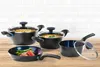 A set of cookware, including pots and a frying pan, is displayed on a wooden surface against a tiled white background. Anteprima dell’immagine prodotto