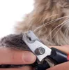 A close-up shot of a person trimming a cat's nail with nail clippers. Náhľad obrázku produktu