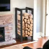 A black metal firewood rack filled with logs is placed next to a stone fireplace. Anteprima dell’immagine prodotto