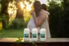 Two people hugging in a garden with three Bolsius oil candle inserts in the foreground. Podgląd zdjęcia produktu