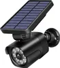 A black solar-powered outdoor light with a solar panel and a dummy camera. Anteprima dell’immagine prodotto
