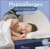 A woman sleeping peacefully in a bed with white bedding. Produktbild-Vorschau
