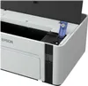 Close-up view of the top section of a white Epson printer, showing the open lid and a blue plastic component. Náhľad obrázku produktu
