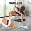 A woman is performing a yoga pose on a yoga stool in a bright room. Voir les images du produit