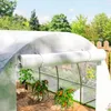 A greenhouse with plants growing inside, showing a roll-up door mechanism. Voir les images du produit