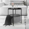 A side table with a basket and a blanket next to a sofa. Náhled obrázku produktu