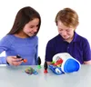 Two children are playing with a 3D printing pen and a turtle-shaped object. Podgląd zdjęcia produktu