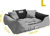 A gray dog bed with black accents and pillows, with dimensions indicated by yellow lines and text. Voir les images du produit