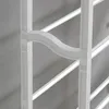 Close-up view of a white metal structure with curved elements and horizontal bars. Produktbild-Vorschau
