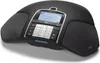A black conference phone is shown from a slightly elevated front-left angle on a white background. Náhled obrázku produktu