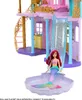 A dollhouse playset with a doll in the foreground. Podgląd zdjęcia produktu