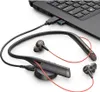 A black Poly Voyager 6200 UC headset with red accents is connected to a laptop via a USB dongle. Voir les images du produit