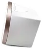A side view of a pink and white alarm clock with a rose gold trim. Anteprima dell’immagine prodotto