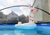 An inflatable llama pool float in a pool, under a transparent pool cover. Anteprima dell’immagine prodotto